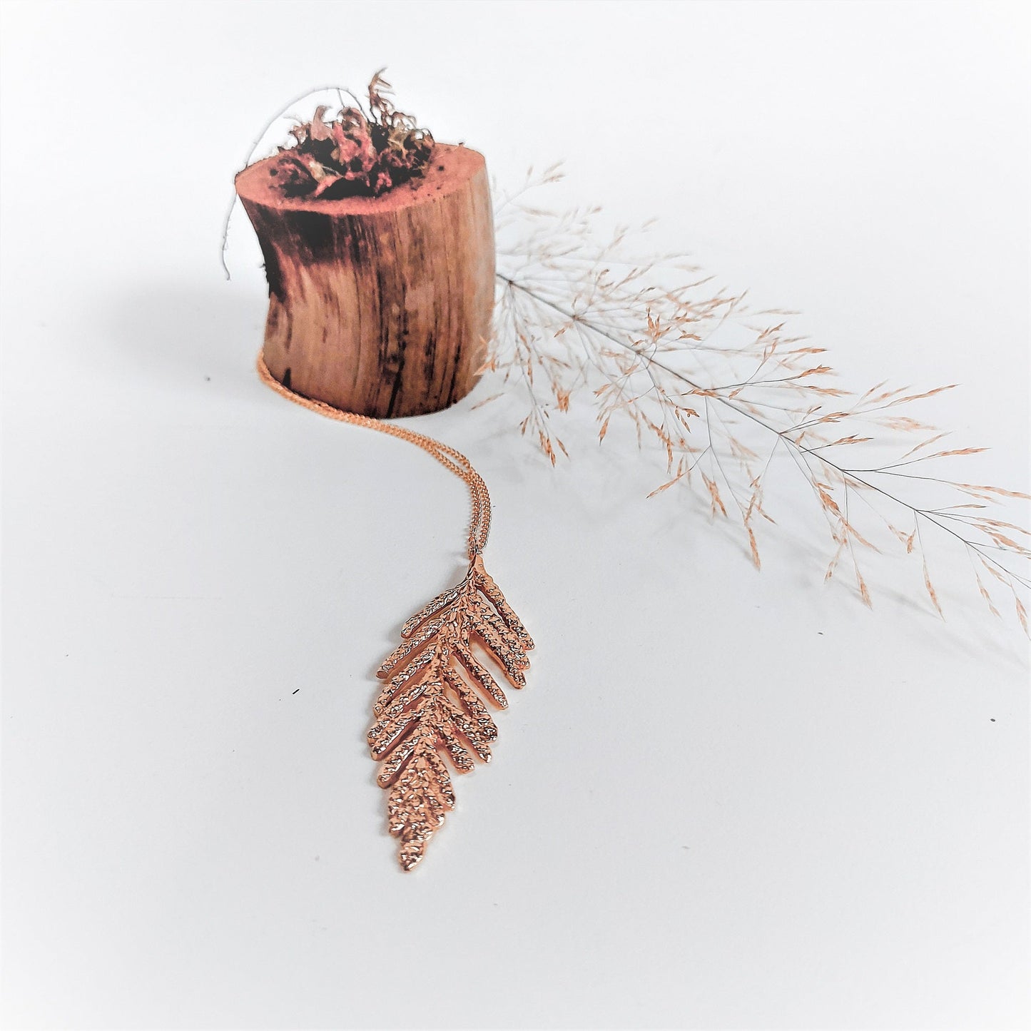 Rose gold vermeil cedar necklace with small tree stump and leaves