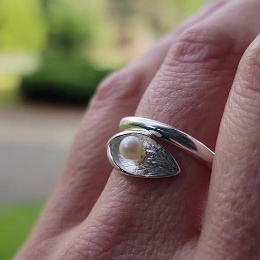 model wearing cala lily silver fresh water pearl wrap around  ring