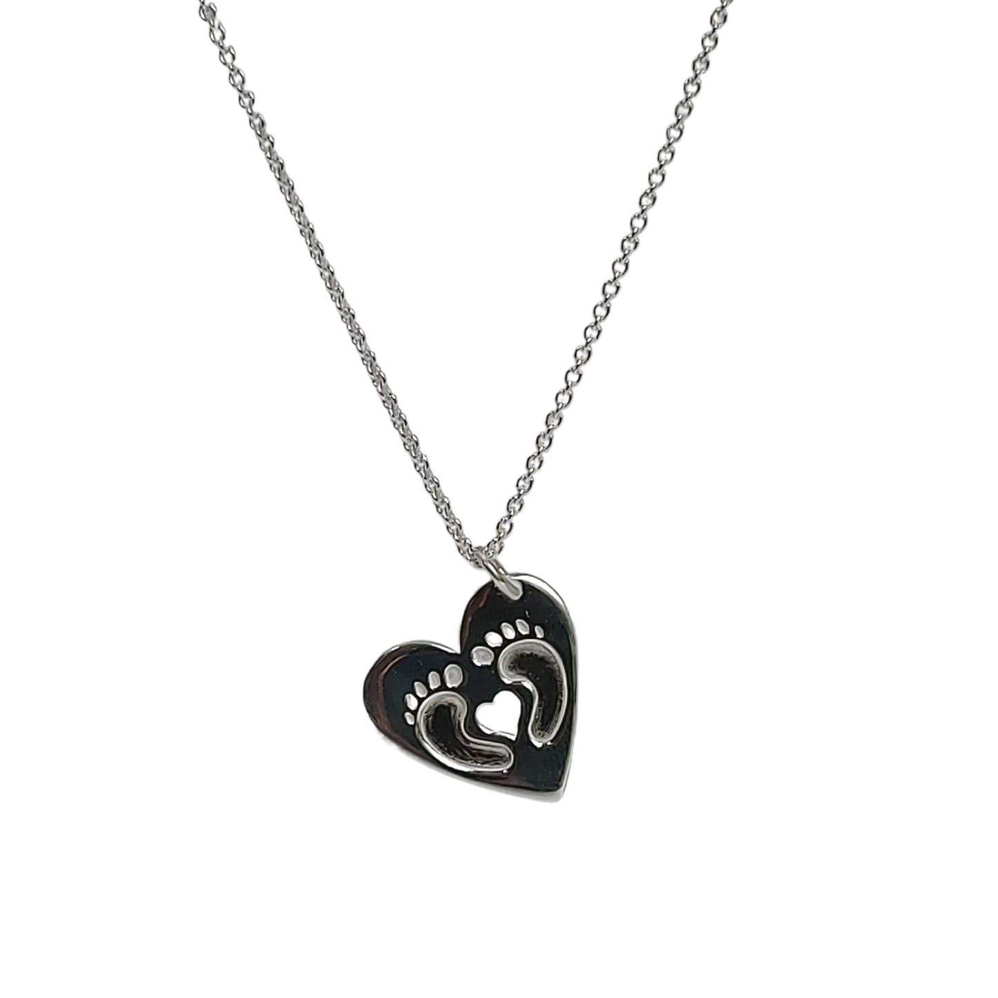 Sterling silver Clubfoot strong necklace with two tiny curled feet embossed into heart, and heart cut out in center