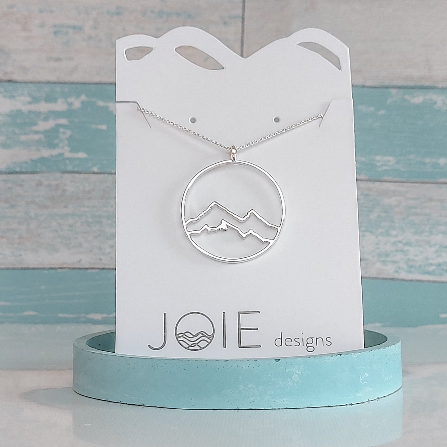 circle necklace, 925 sterling silver coastal mountain circle pendant necklace showcased on a white jewellery card