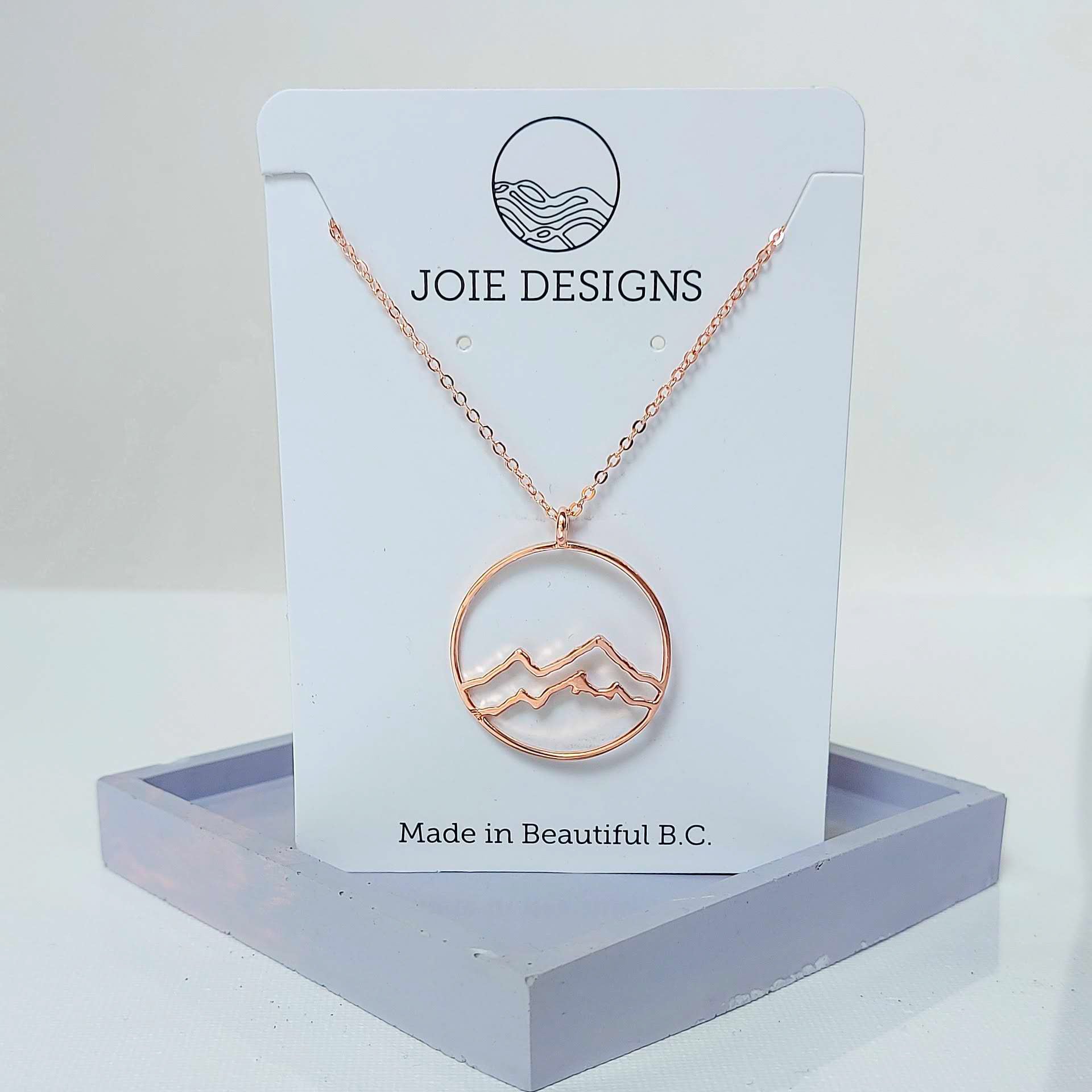 circle necklace, 18k yellow gold plated coastal Mountain circle  pendant necklace showcased on a jewellery card