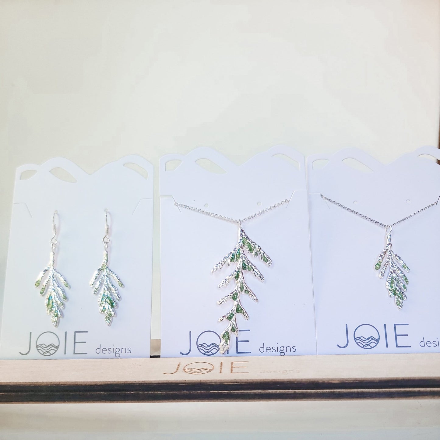 Silver petite  Arborvitae and Thuja Pendant necklaces and cedar leaf earrings  embellished with with emerald green resin detailing