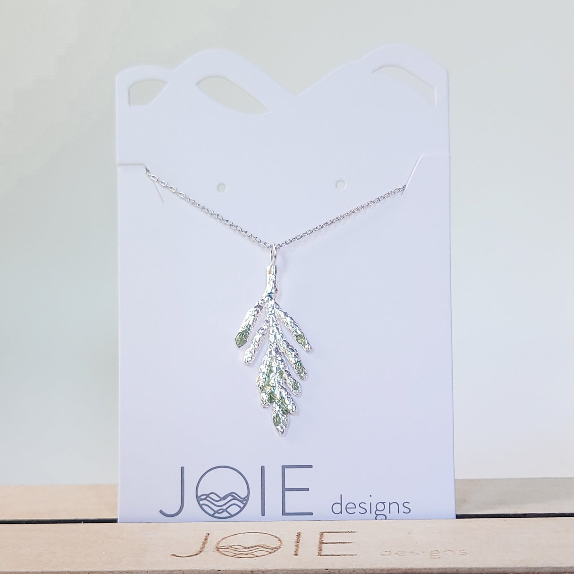 Silver petite  Arborvitae  Pendant necklace  embellished with with emerald green resin detailing