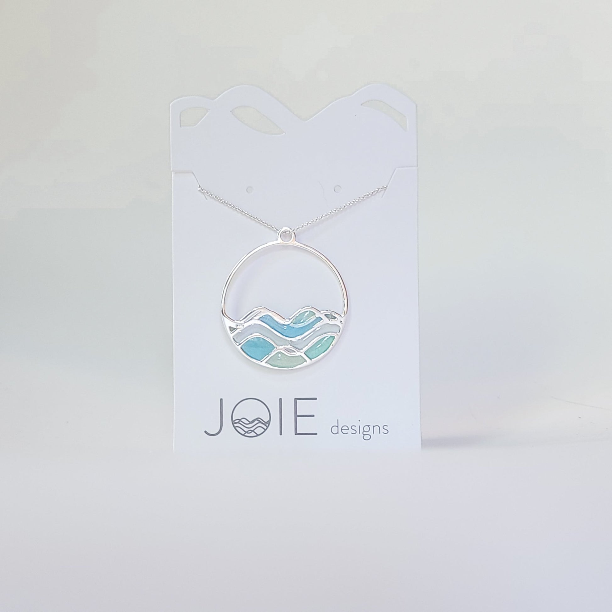 Embellsihed silver and resin blue limited edition high tide necklace side 2