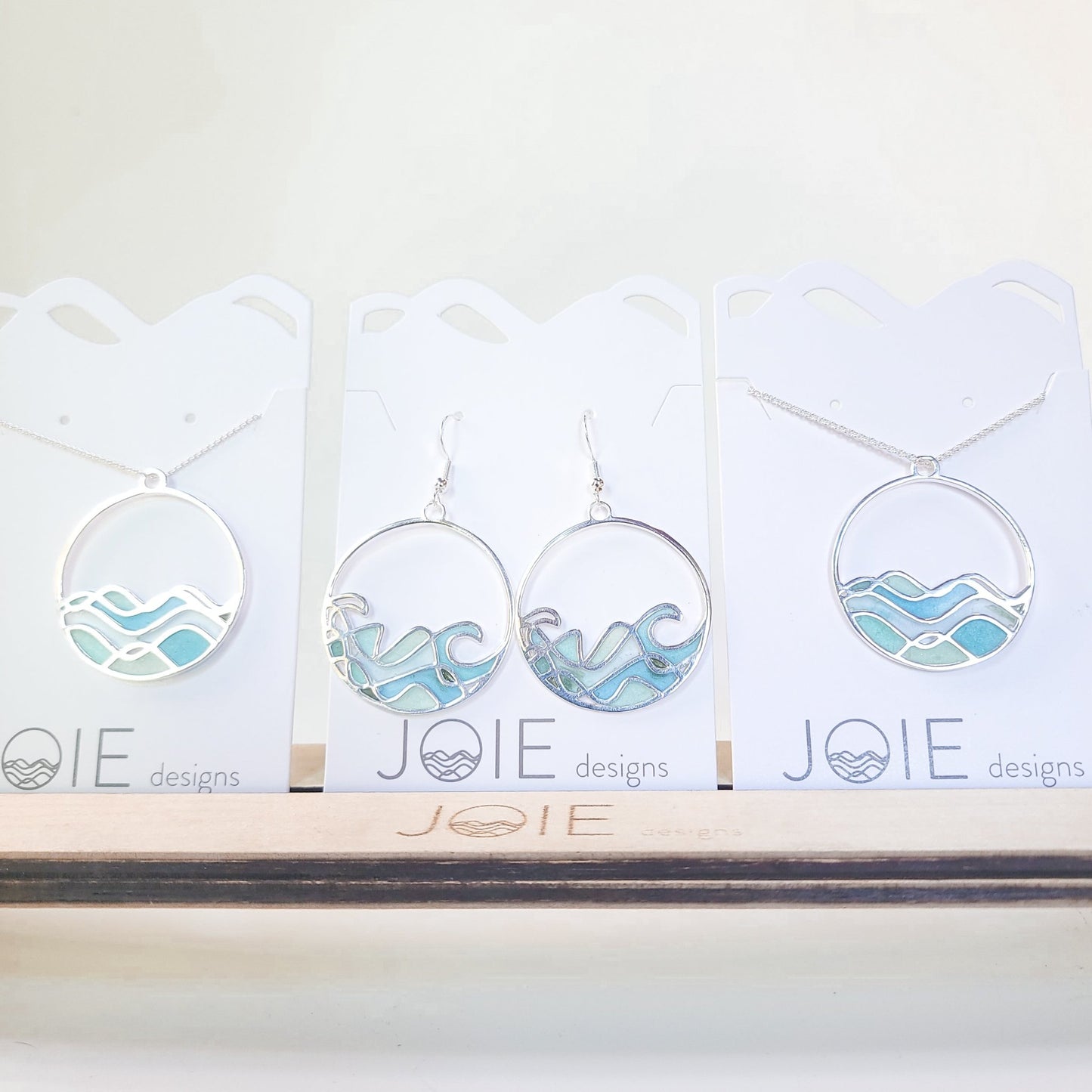 Embellsihed silver and resin blue limited edition high tide necklace with sombrio earrings