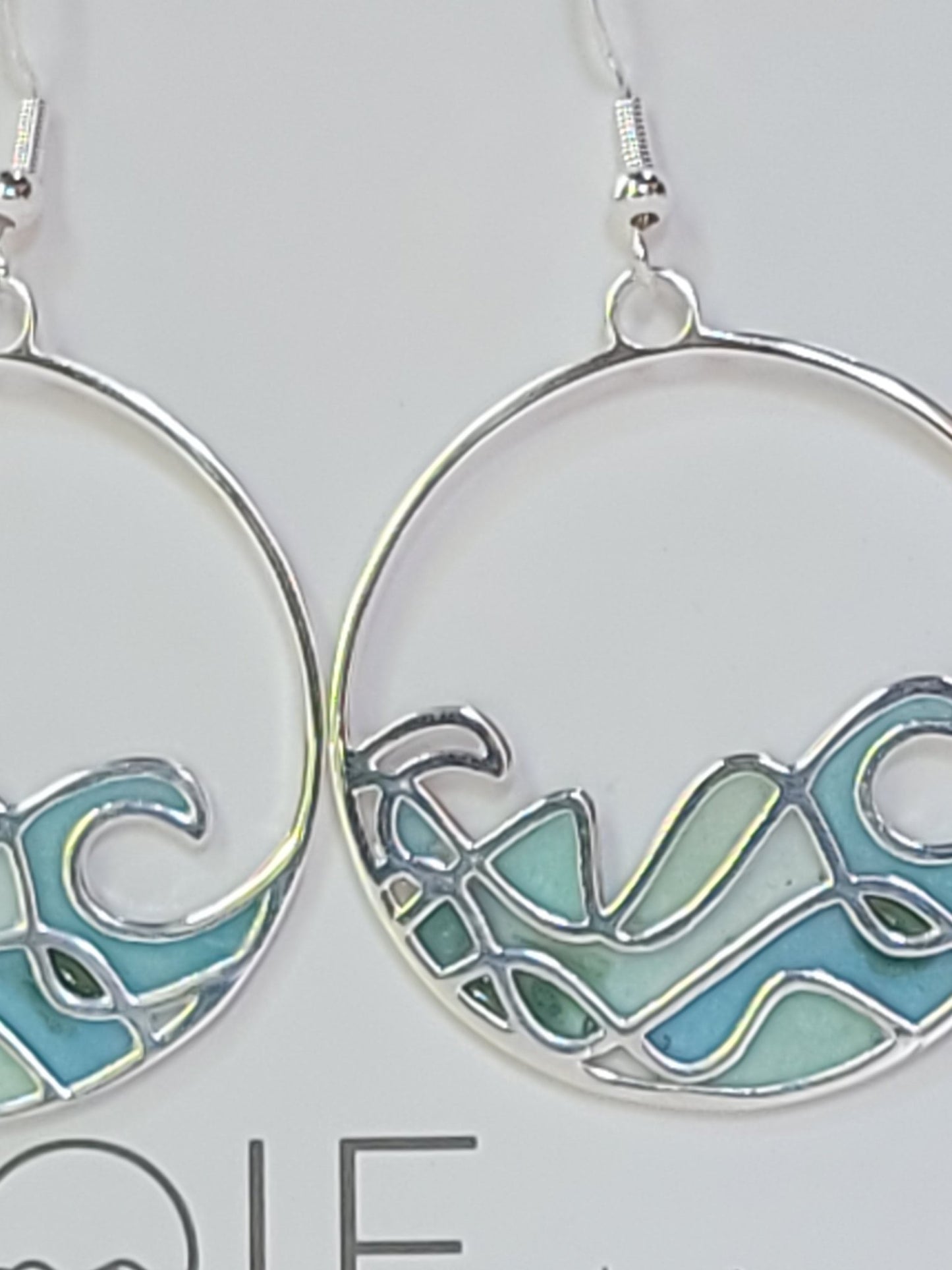 detail of blue resin work on Sombrio wave earrings