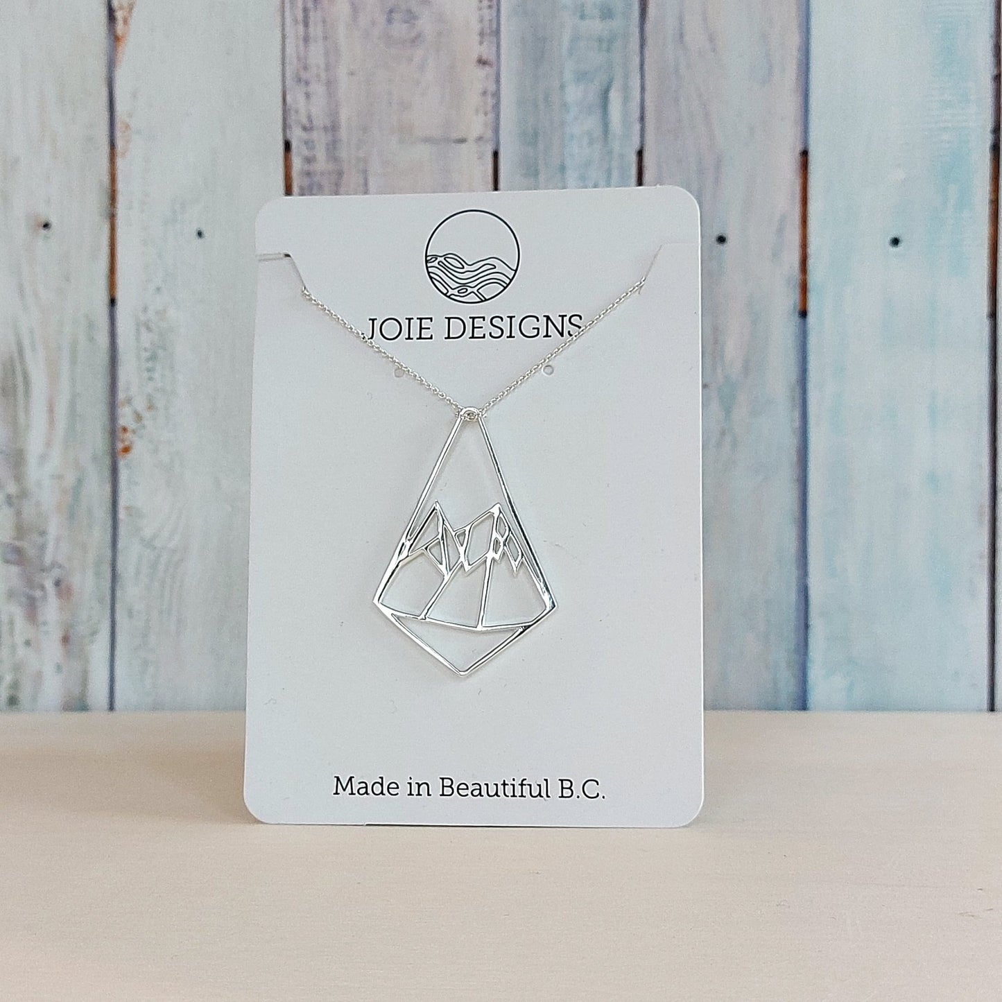 925 sterling silver geometric mountain design pendant necklace showcased on a jewellery card
