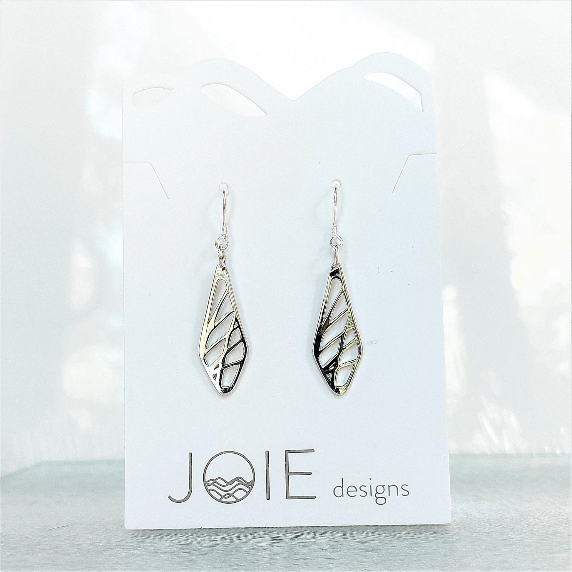 sterling silver diamond-shaped drop earrings with grass pattern on white jewelry card