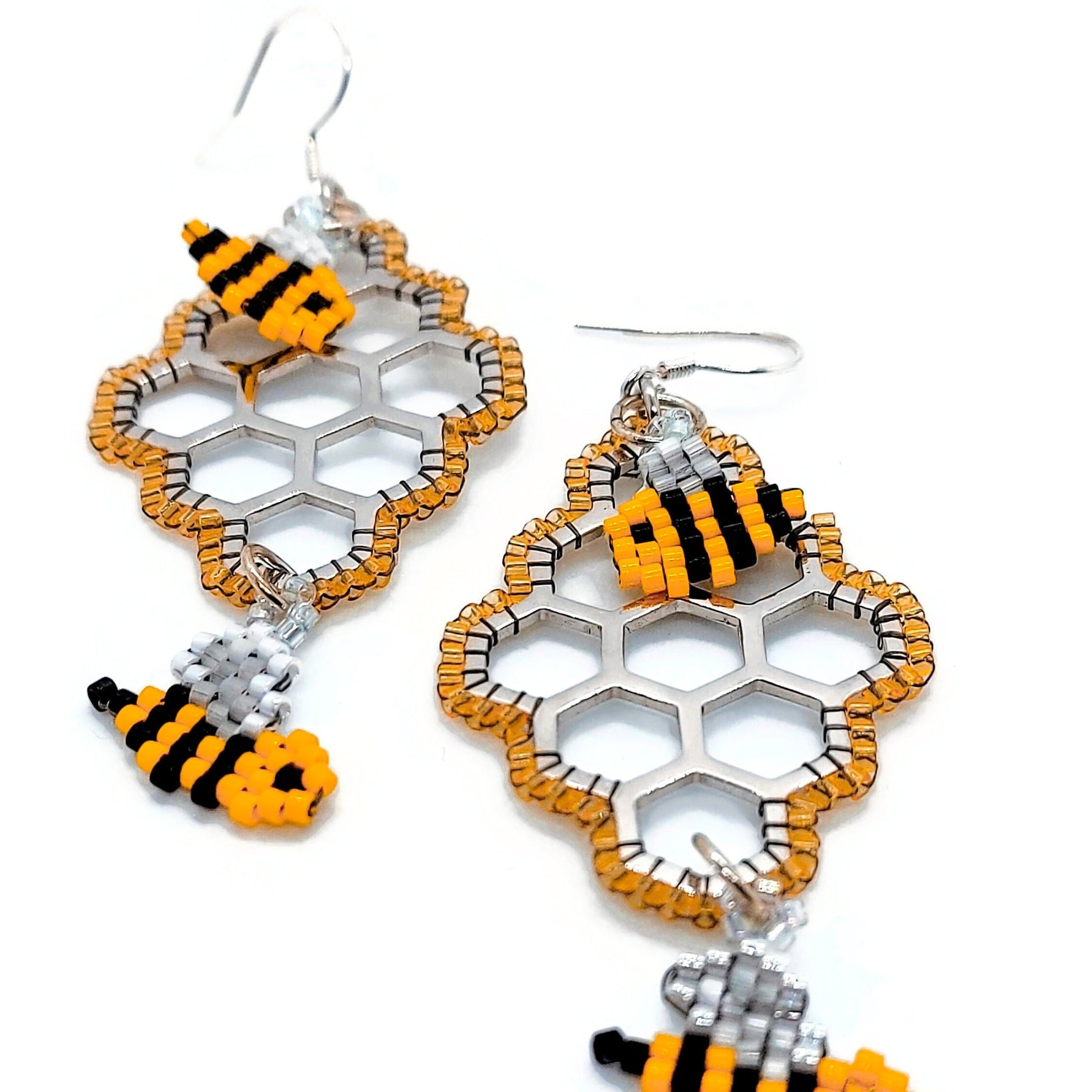 close up of Sterling Silver honeycomb beautiful beadwork including perfect little honey bees by talented bead artist Carla Maxmuwidzumga.