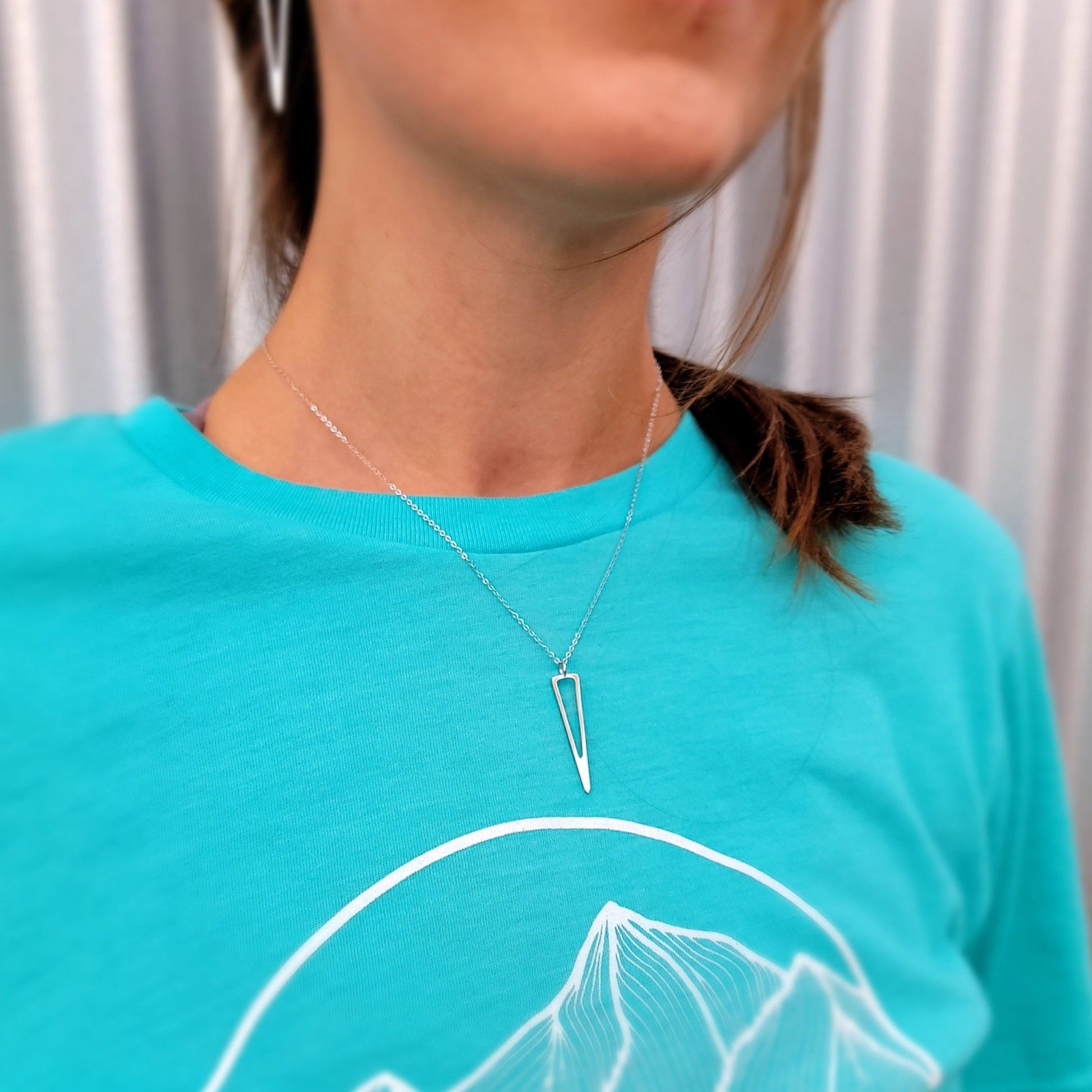 model wearing modern minimalist icicle necklace in sterling silver