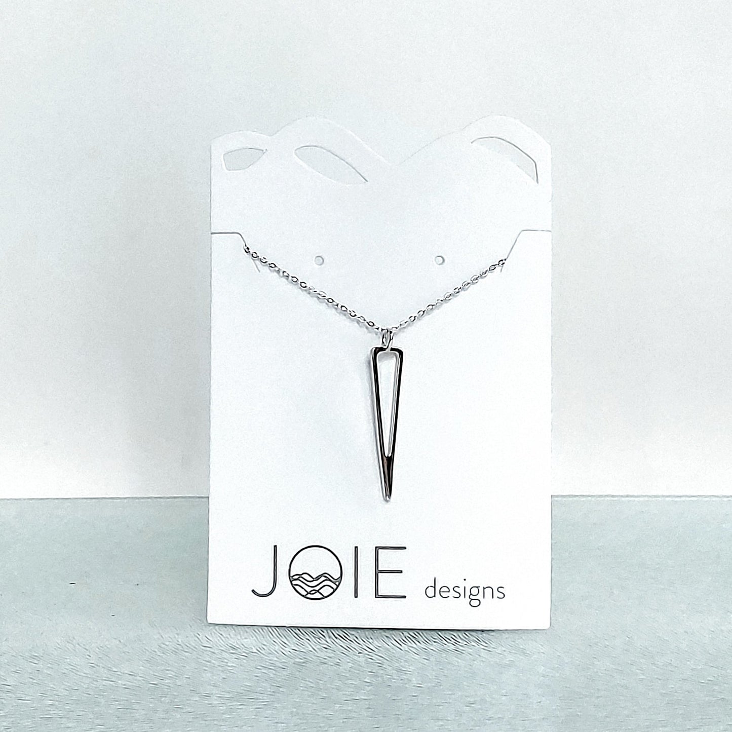 925 sterling silver icicle triangle design pendant necklace showcased on a jewellery card