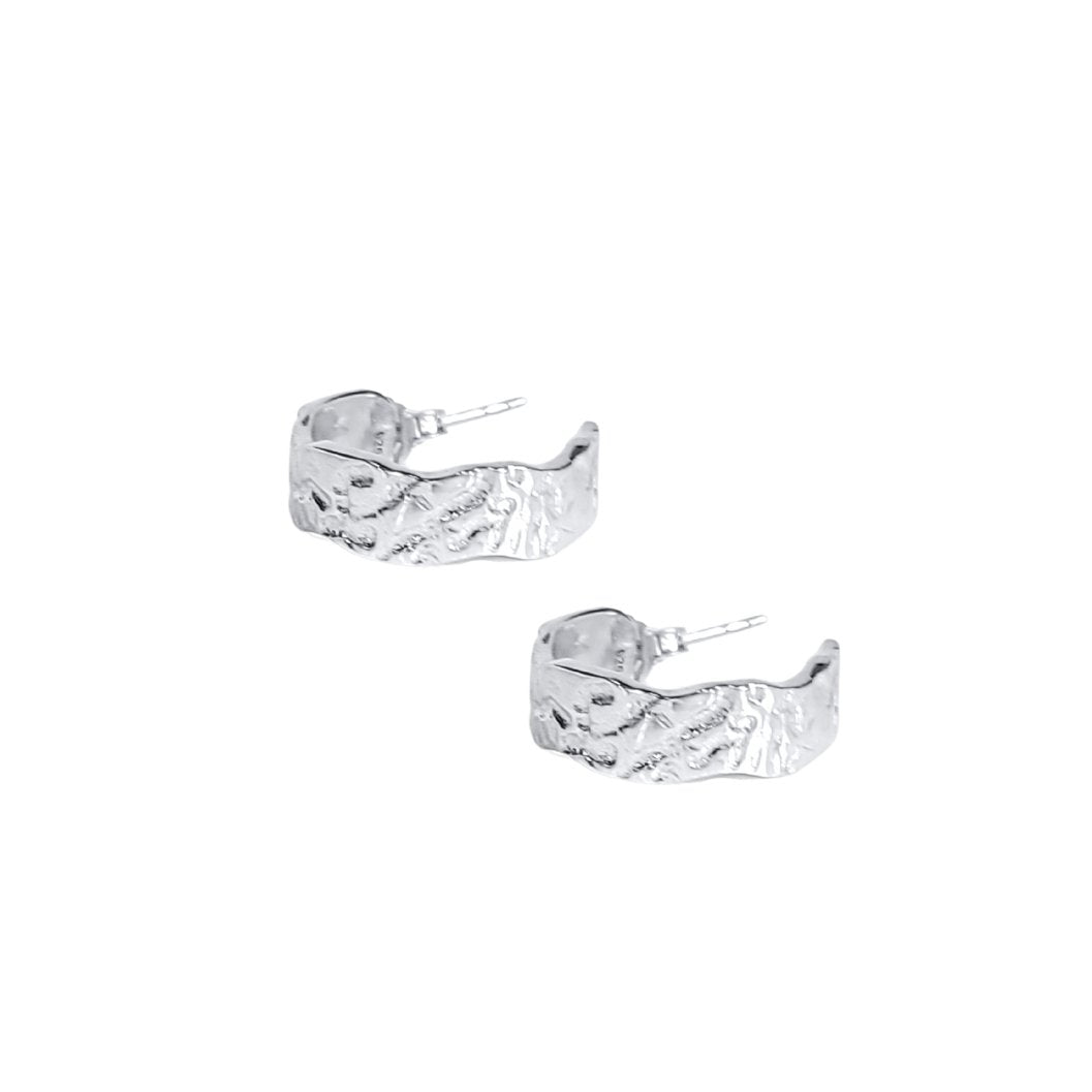 classic sterling silver hoops earrings with natural texture close up side view
