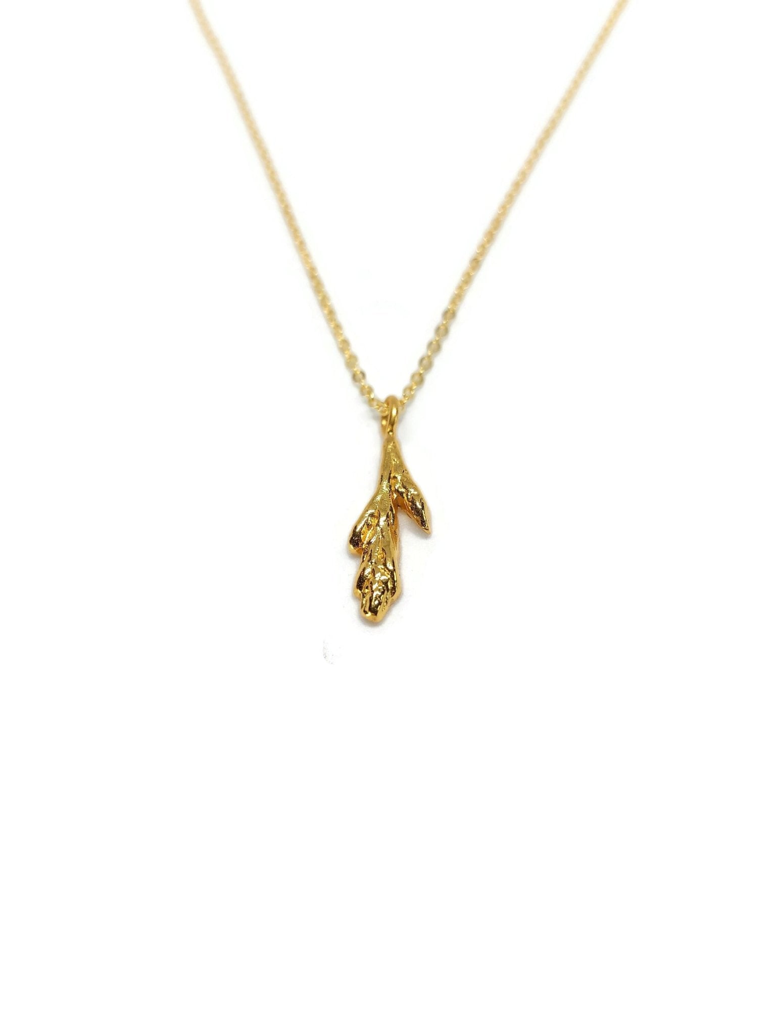 18k yellow gold plated little cedar leaf design pendant necklace on white background - 1
