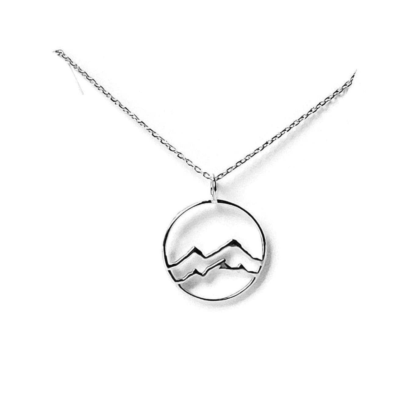rhodium plated sterling silver little coast mountain circle pendant necklace on white background