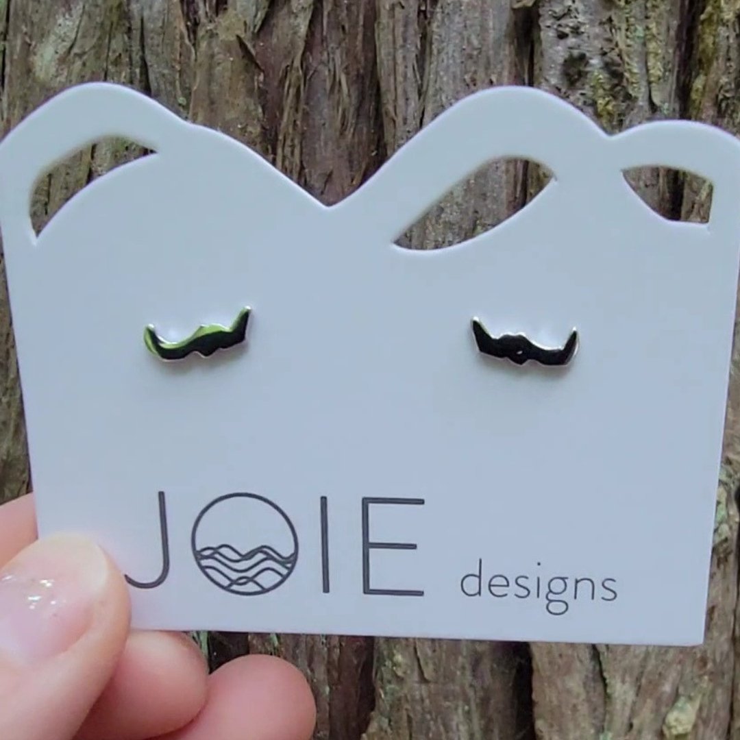 close up of sterling silver little Savary island stud earrings  on jewelry card