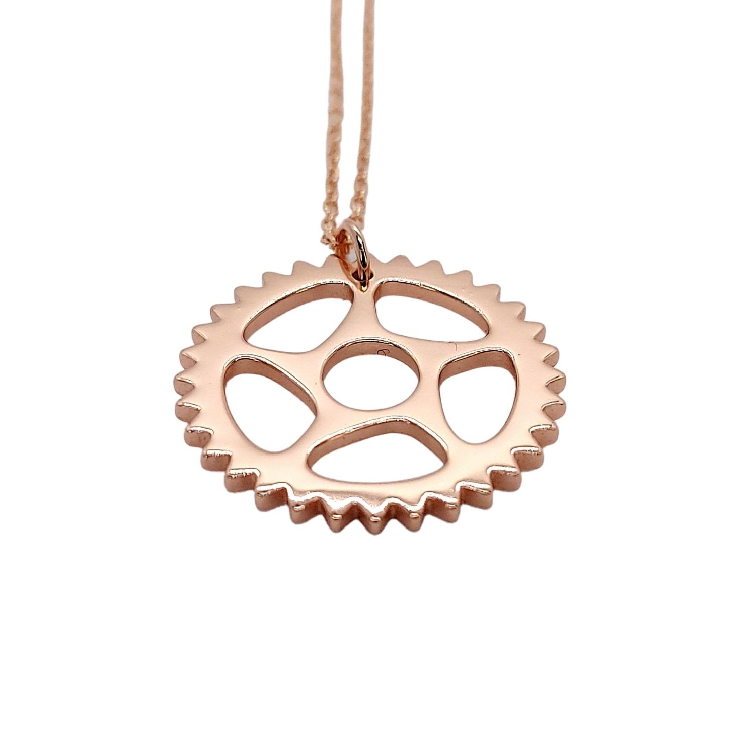 18 rose gold plated bike chain ring design pendant necklace with a white background