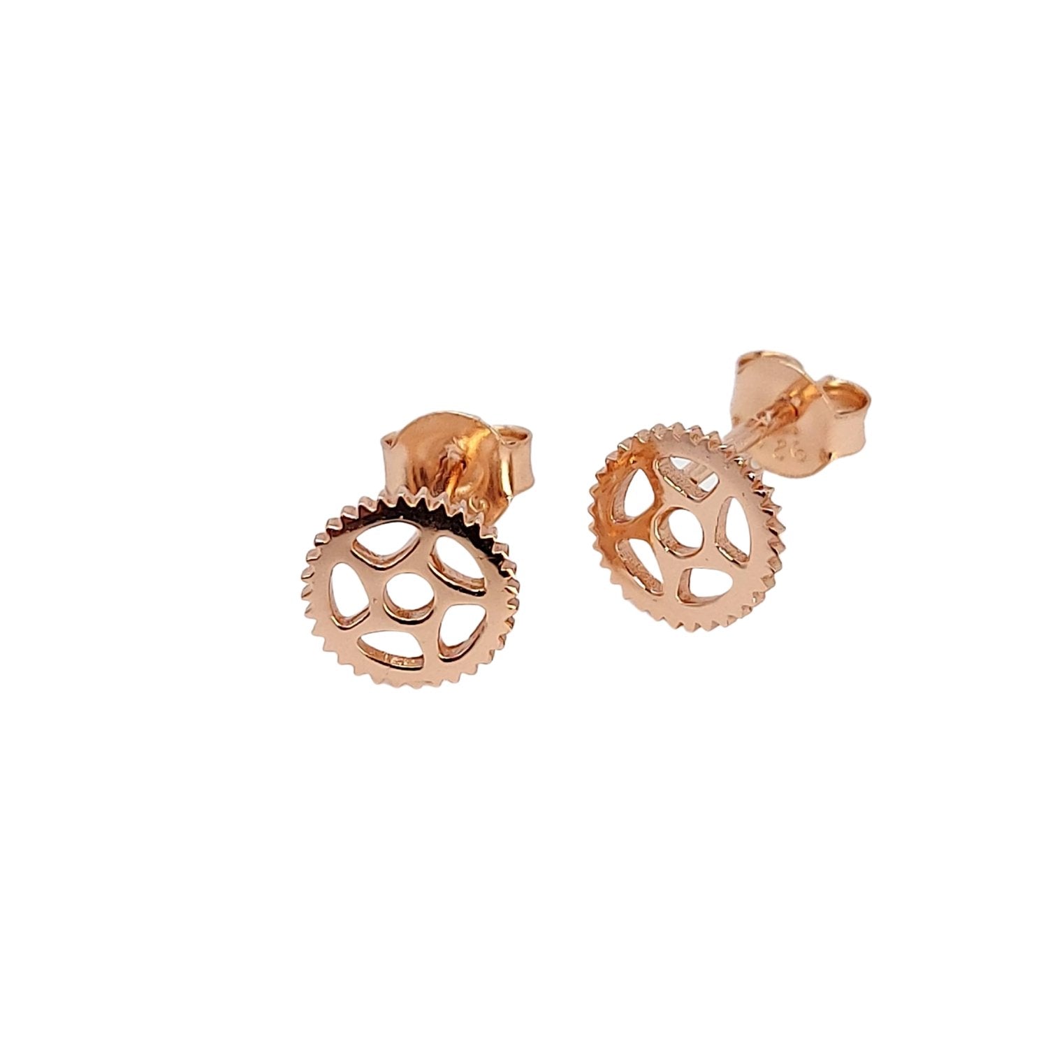 18k rose gold bike cog stud earrings with white background