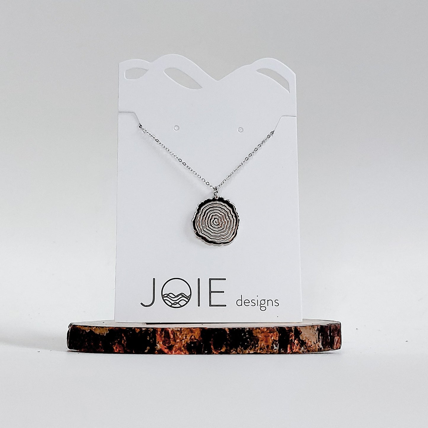 925 sterling silver tree rings inspired pendant necklace showcased on a jewellery card