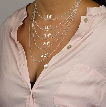 Model wearing different lengths of necklaces to show where different lengths fall on her