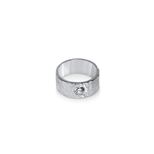 front view of driftwood textured sterling silver ring with 4mm white topaz