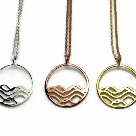 18k gold plated, rose gold and rhodium plated 925 sterling silver high tide necklaces on a white background