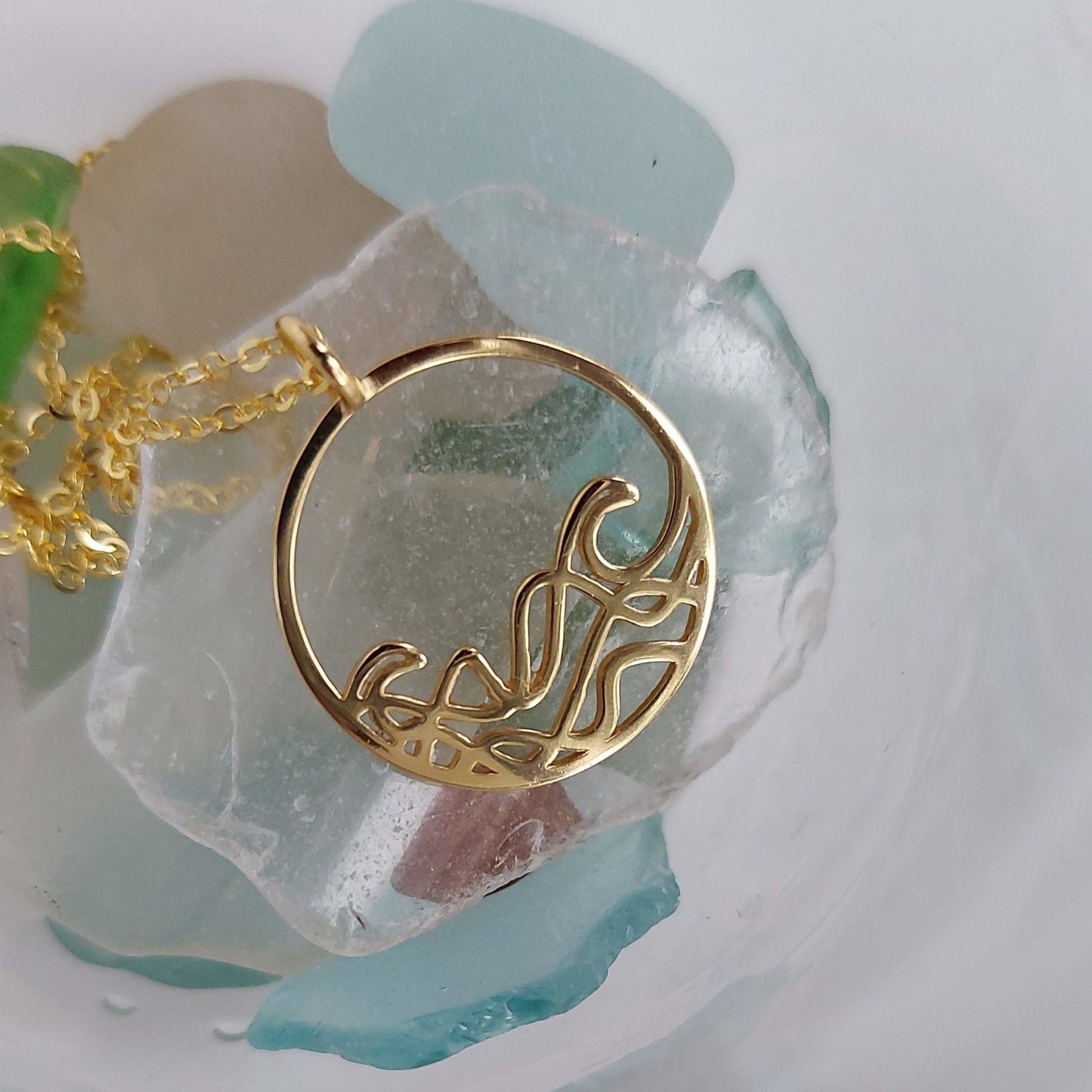 18k gold plated Petite Sombrio Ocean Surf Wave Circle Necklace shown with sea glass