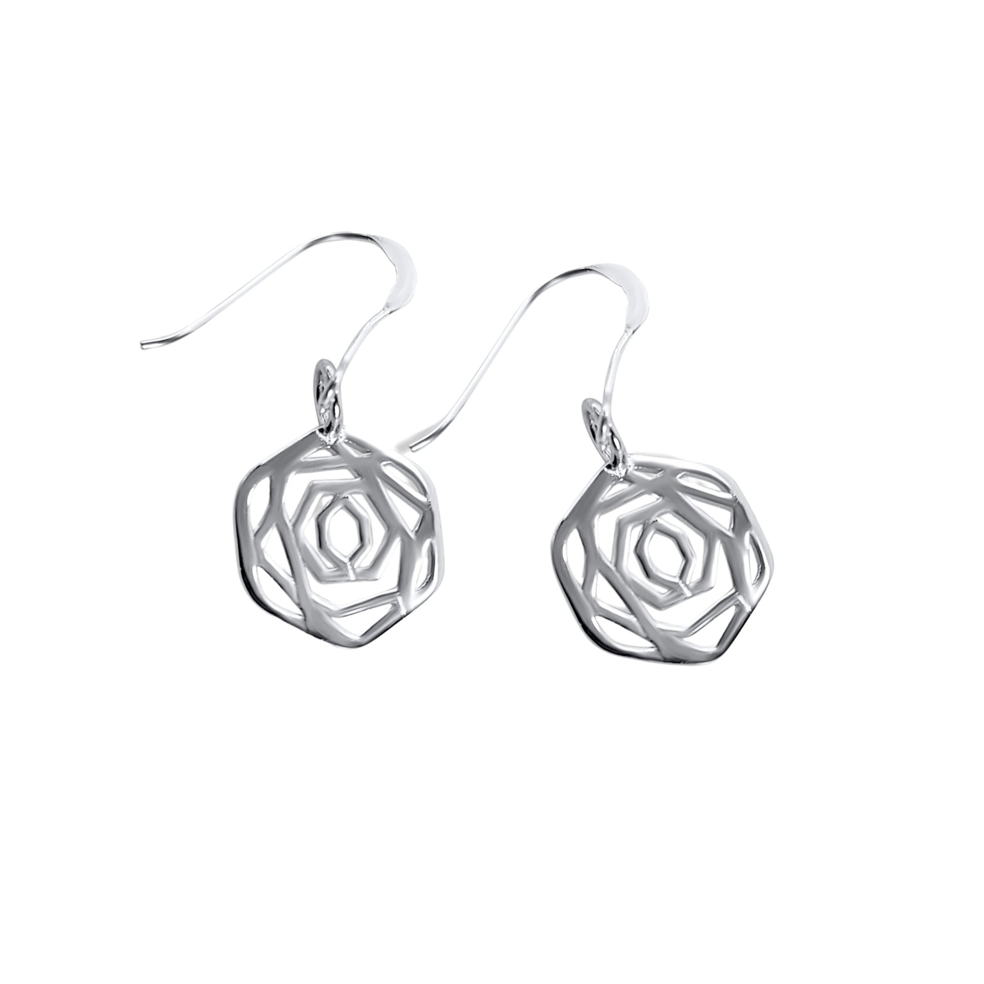 Sterling silver flower and garden inspired dangle earrings on white background