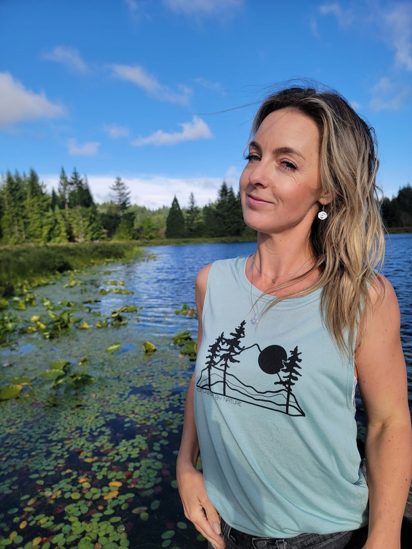 model in nature wearing Rosie flower and garden inspired jewelry set