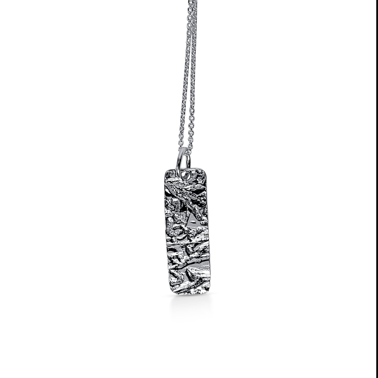 silver rectangle pendat with drift wood texture and cable chain necklace