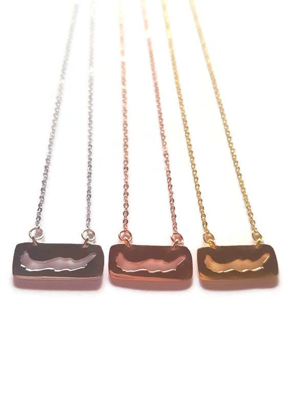 3 sterling silver and gold plated necklaces featuring a cut-out of Savary Island in rectangle pendant charm lines in a row