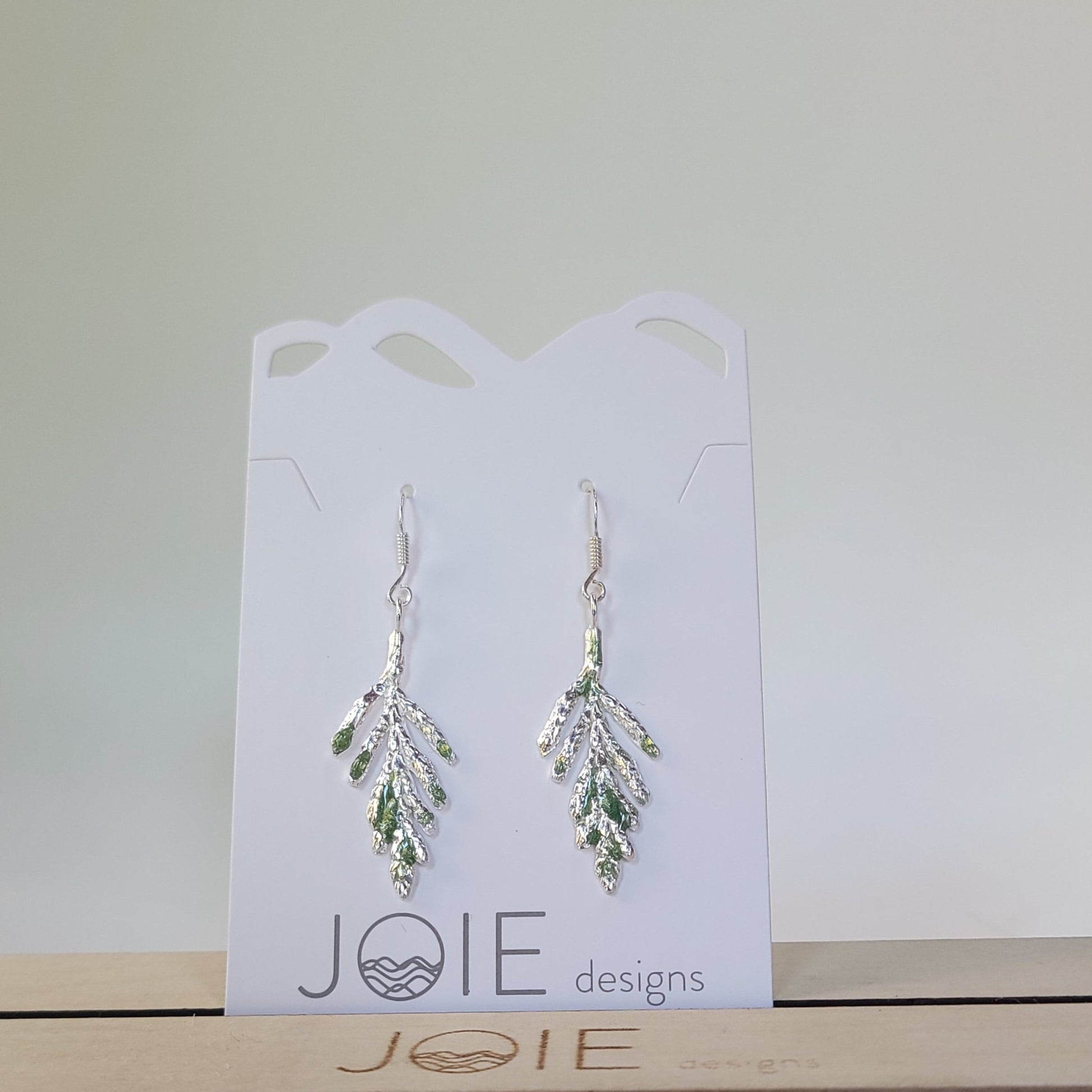 silver cedar arborvitae earrings with green resin detailing