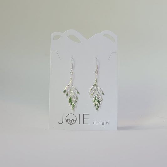 silver cedar leaf dangle earrings embellished with green resin