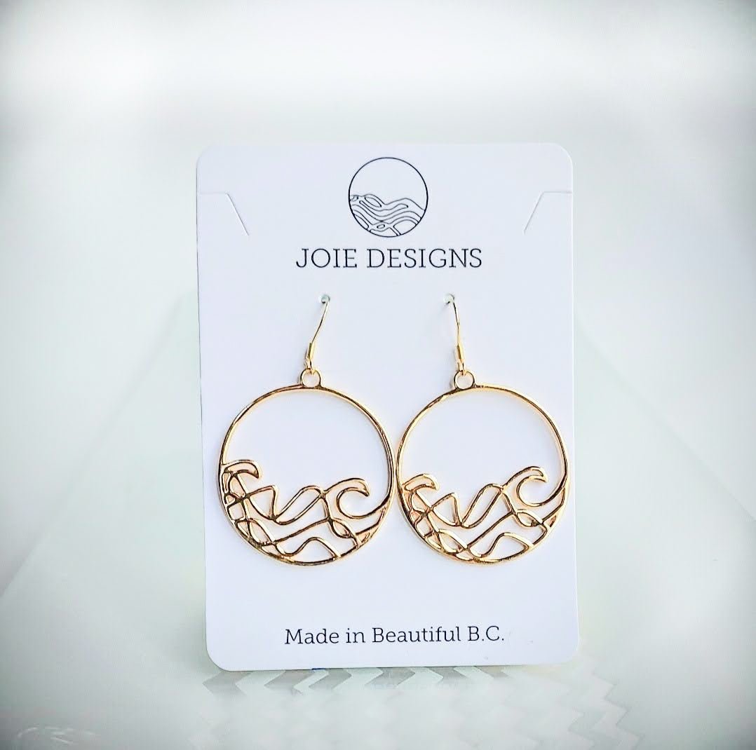 18k yellow gold plated Sombrio Circle Surf Wave Earrings on a jewellery card