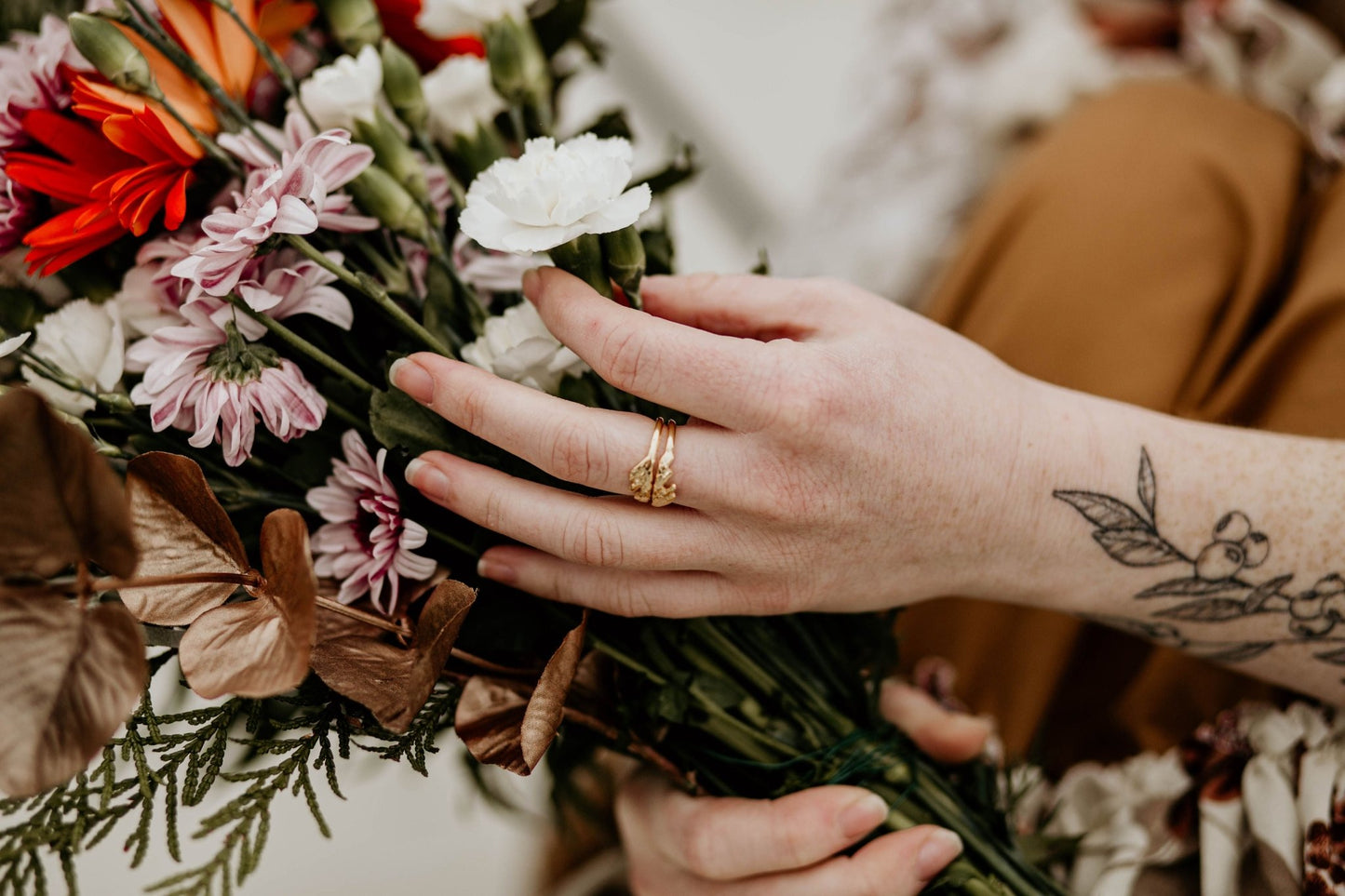 Unique botanical jewelry on model: Cedar leaf cast in silver and gold plated for a stunning ring